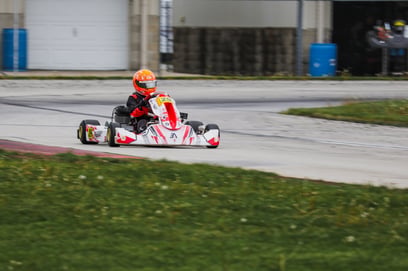Asher racing in a cart