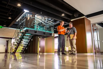 CertaSite tech explaining details of service to client