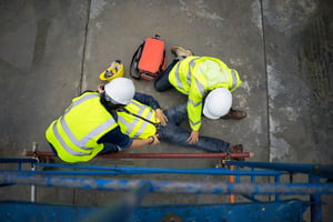 workers aiding an injured employee