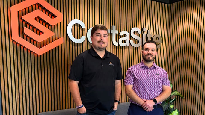 jeff and jonathan standing together with the certasite sign in the background