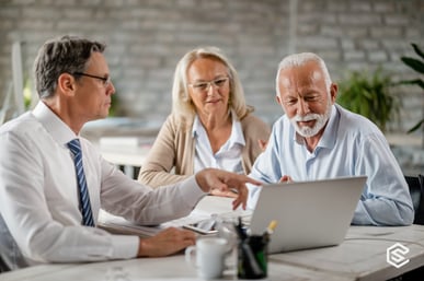 mature-couple-and-insurance-agent-using-computer-during-consultations-picture-id1183998991